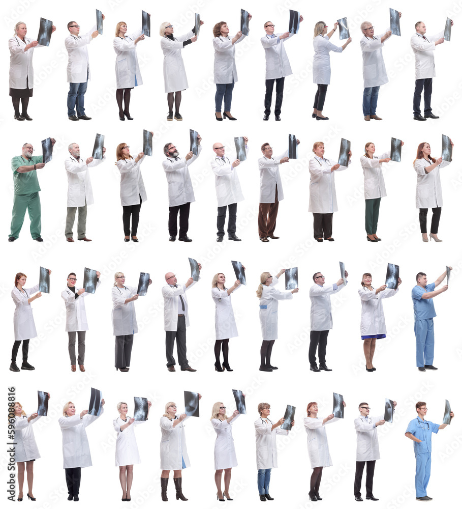 group of doctors holding x-ray isolated on white group of doctors holding x-ray isolated on white
