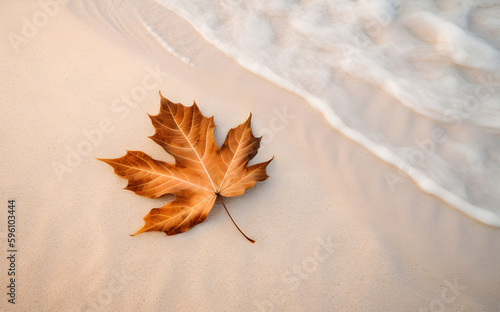 Orange maple leaf on white sand on the sea beach in autumn. Free space for text. Generative AI