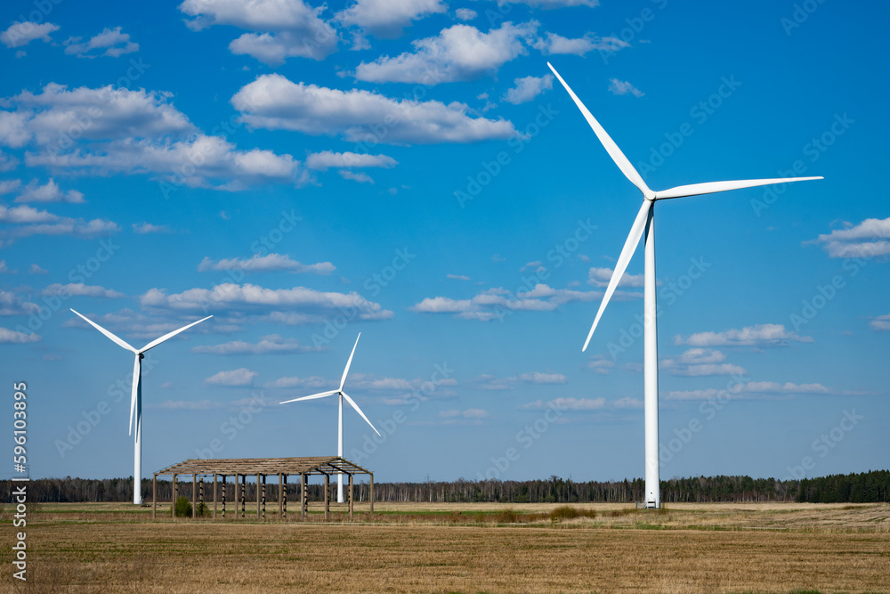 wind turbine in the wind, three windmills in the field wind turbine in the wind, three windmills in the field