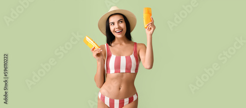 Pretty young woman with sun...