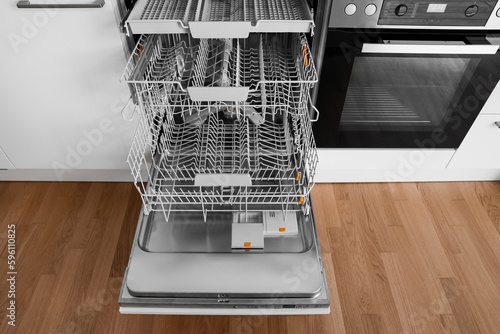 Open dishwasher in modern kitchen