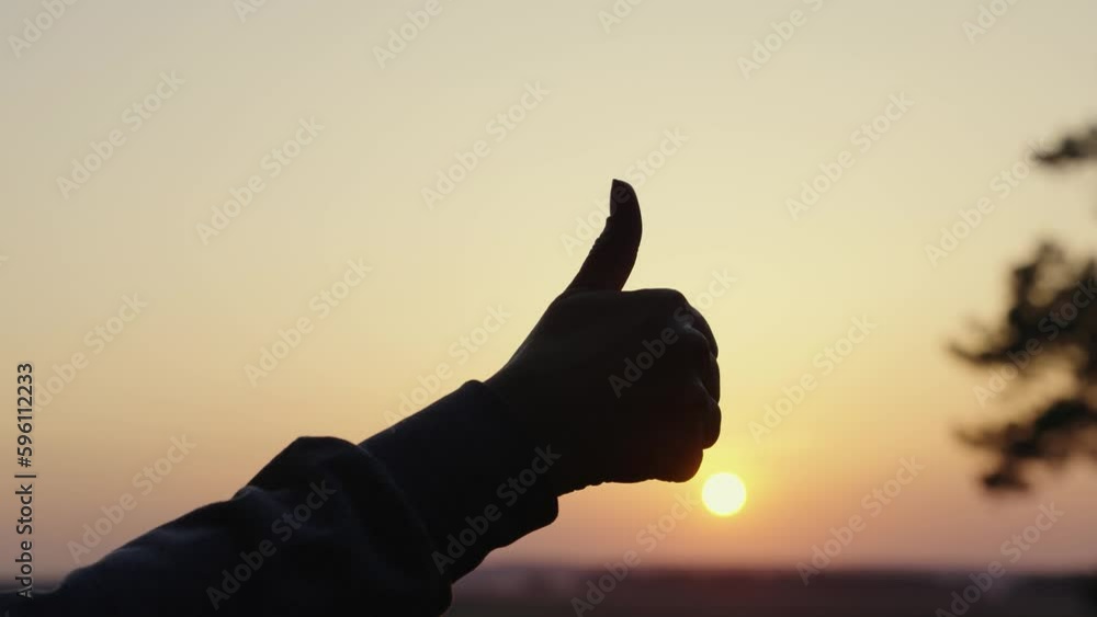 Gesture to show hand like outdoors, silhouette. Hand with raised thumb ...