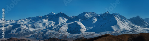Panoramic view of snow-covered mountain peaks in Kyrgyzstan