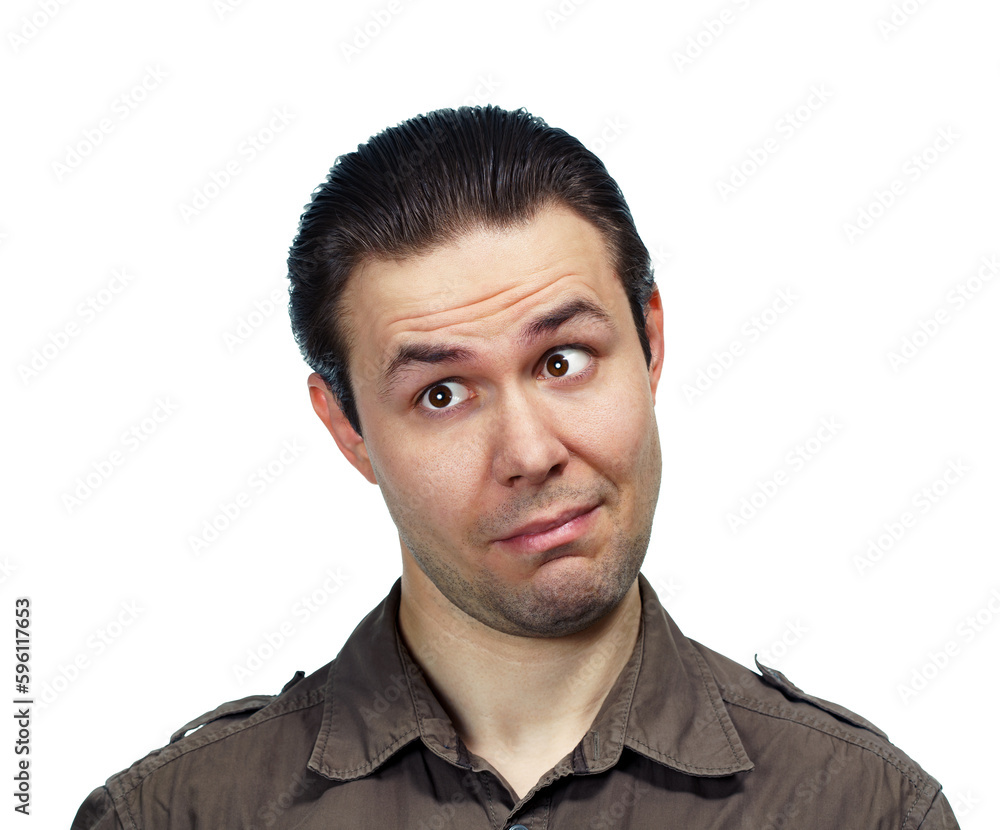 Fototapeta premium Young surprised man looking aside, emotional portrait on white background