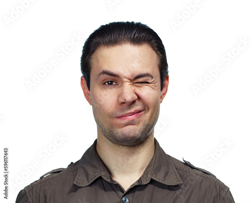 Foto Young handsome man blinking portrait on white background