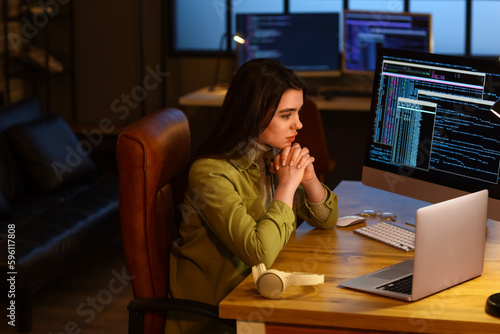 Young female programmer wor...