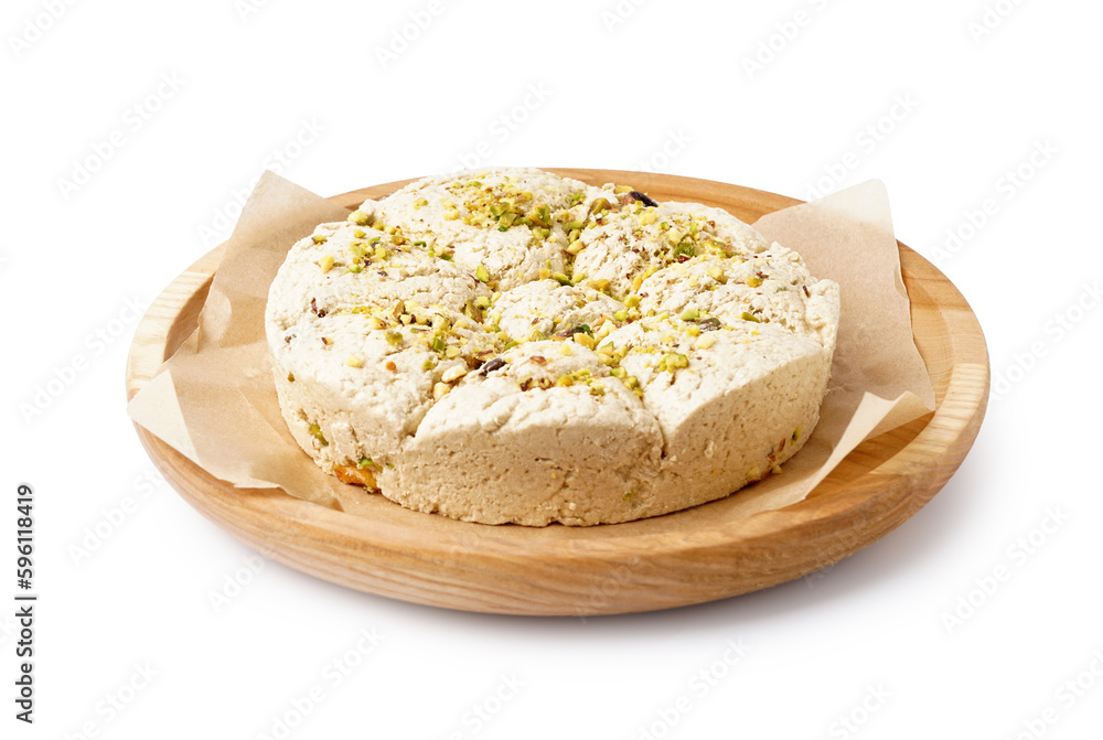 Plate of tasty Tahini halva with pistachios on white background Plate of tasty Tahini halva with pistachios on white background