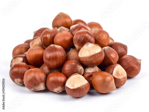 A pile of hazelnuts on a white background