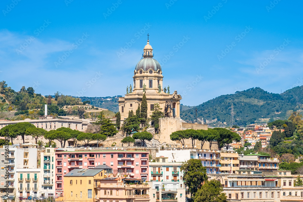 Panoramic view of Messina. Votive Temple of Christ the King or Tempio di Cristo Re on hill over town as memorial to Italian soldiers. Sicily island, Italy