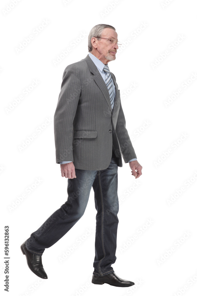 full length picture of a mid aged business man walking towards the camera and smiling. full length picture of a mid aged business man walking towards the camera and smiling.