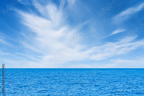 Blue sea and white clouds on sky. Water cloud horizon background. Feeling calm, cool, relaxing. The idea for cold background and copy space on the top. the ocean deep indigo