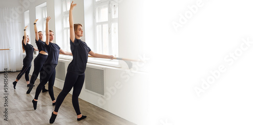 group of women are training at the ballet barre. Copy space banner for your advertising