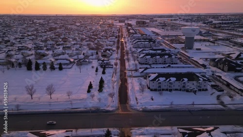 neighborhood in Fargo, North Dakota. houses and water tower. snow and winter in the city photo