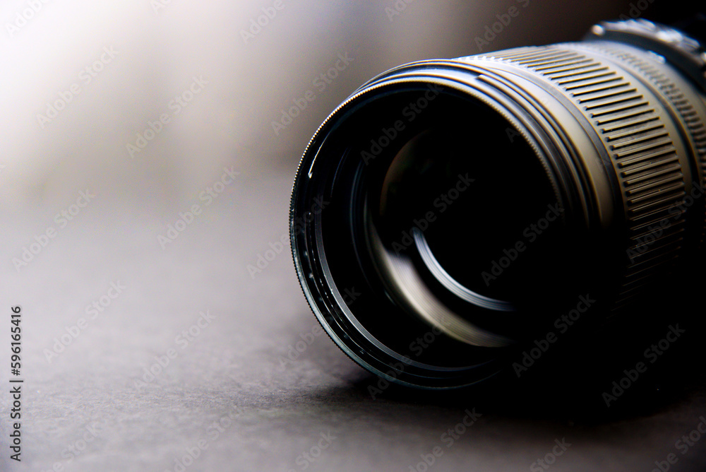 close up of a camera lens on a black background with copy space