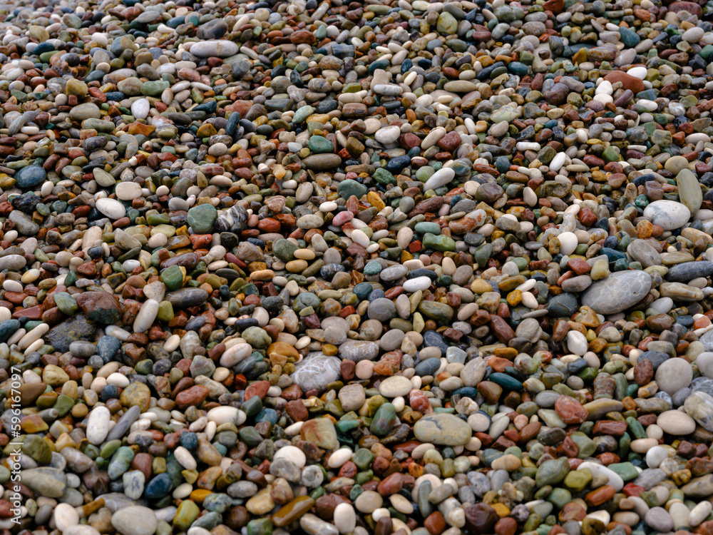 colorful pebbles on the beach colorful pebbles on the beach