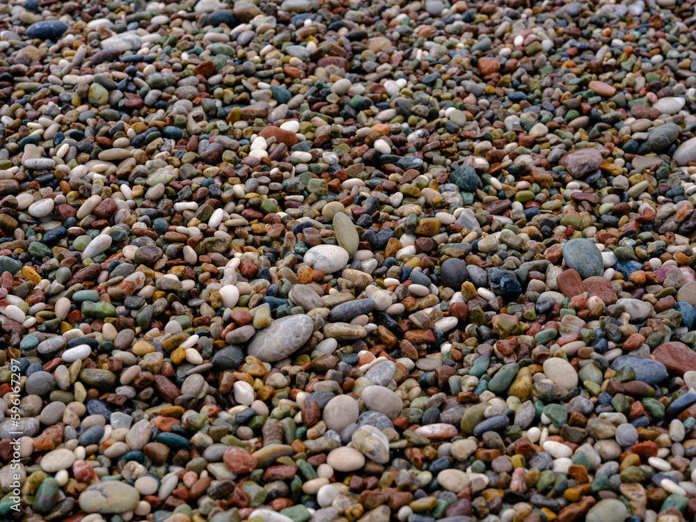 colorful pebbles on the beach colorful pebbles on the beach