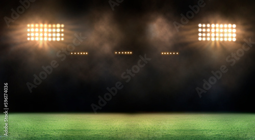 Green soccer field  bright spotlights   