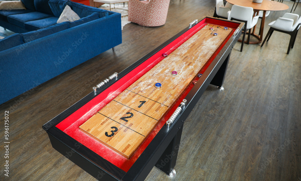 Shuffleboard is a game of precision and strategy, where players slide