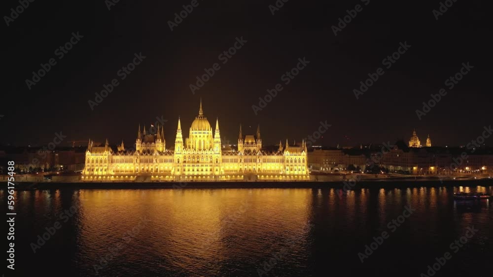 Aerial skyline view of Budapest and River Danube, Hungary. Drone view of the illuminated night Hungarian Parliament building. Budapest, Hungary. Aerial view of Budapest Parliament Building. Aerial skyline view of Budapest and River Danube, Hungary. Drone view of the illuminated night Hungarian Parliament building. Budapest, Hungary. Aerial view of Budapest Parliament Building.