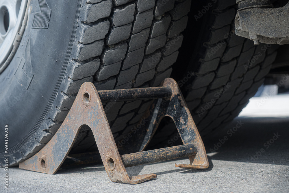 Recoil is installed under wheel of truck. Security. Background.. Recoil is installed under wheel of truck. Security. Background..