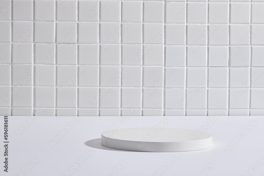 Minimal scene of a white podium in round shape with blank space over a white mosaic tiles background. Vacant space to display your product Minimal scene of a white podium in round shape with blank space over a white mosaic tiles background. Vacant space to display your product