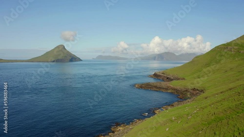 4k drone forward video (Ultra High Definition) of Koltur island. Wonderful morning scene of Faroe Islands, Denmark, Europe. Beautiful summer scenery..