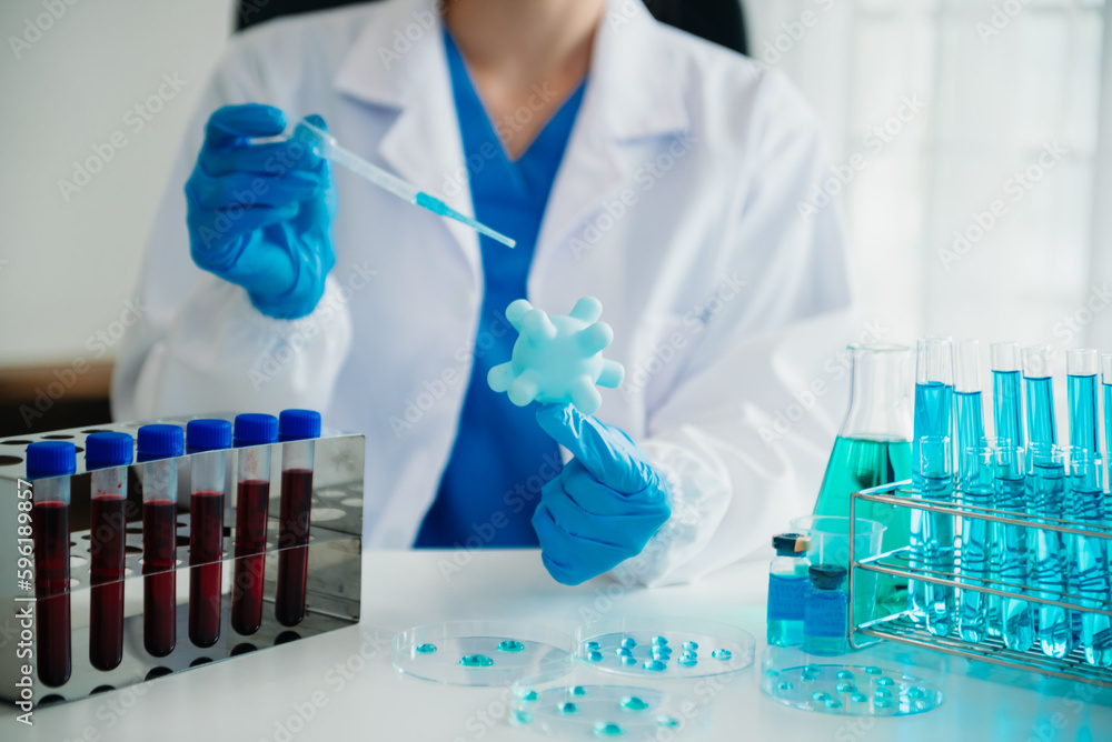 Coronavirus COVID-19 medical test vaccine research and development concept.in a chemistry lab. Coronavirus COVID-19 medical test vaccine research and development concept.in a chemistry lab.
