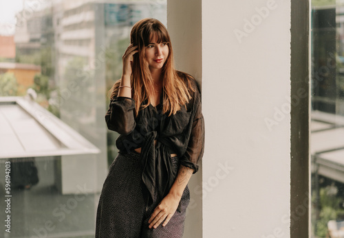 Stylish brunette woman in  cashual outfit posing over urban background. © Svetlana Sokolova