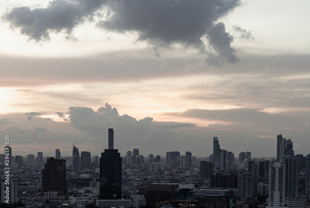 Gorgeous scenic of the sunset with cloud on the sky over large metropolitan city in Bangkok. Nice city view, Space for text, No focus, specifically.