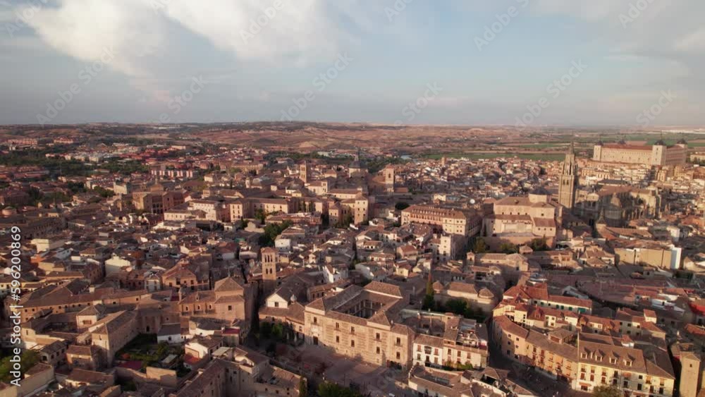 Establishing shot drone flyover of ancient walled city of Toledo, Spain. Push in, beautiful ancient buildings surrounded by water Establishing shot drone flyover of ancient walled city of Toledo, Spain. Push in, beautiful ancient buildings surrounded by water
