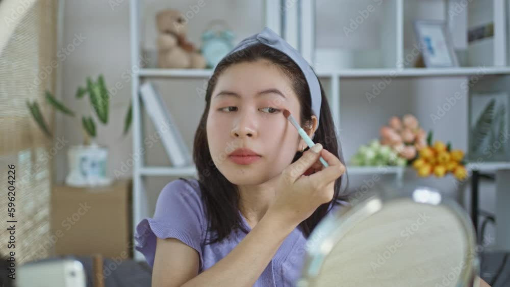 Beautiful women with social media influences are teaching makeup and use cosmetics, In front of the camera to recording vlog video live streaming, Online business on concept of beauty bloggers. Beautiful women with social media influences are teaching makeup and use cosmetics, In front of the camera to recording vlog video live streaming, Online business on concept of beauty bloggers.