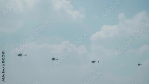 Jakarta, Indonesia - April 9, 2023: Indonesian Air Force (TNI AU) EC120B Colibri helicopter performs at the Indonesian Air Force's birthday event at Halim Perdana Kusuma photo
