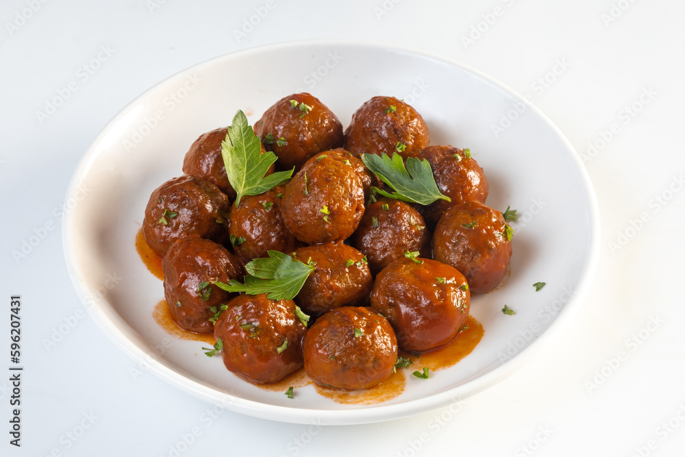 Meatballs served with tomato sauce in frying pan Meatballs served with tomato sauce in frying pan