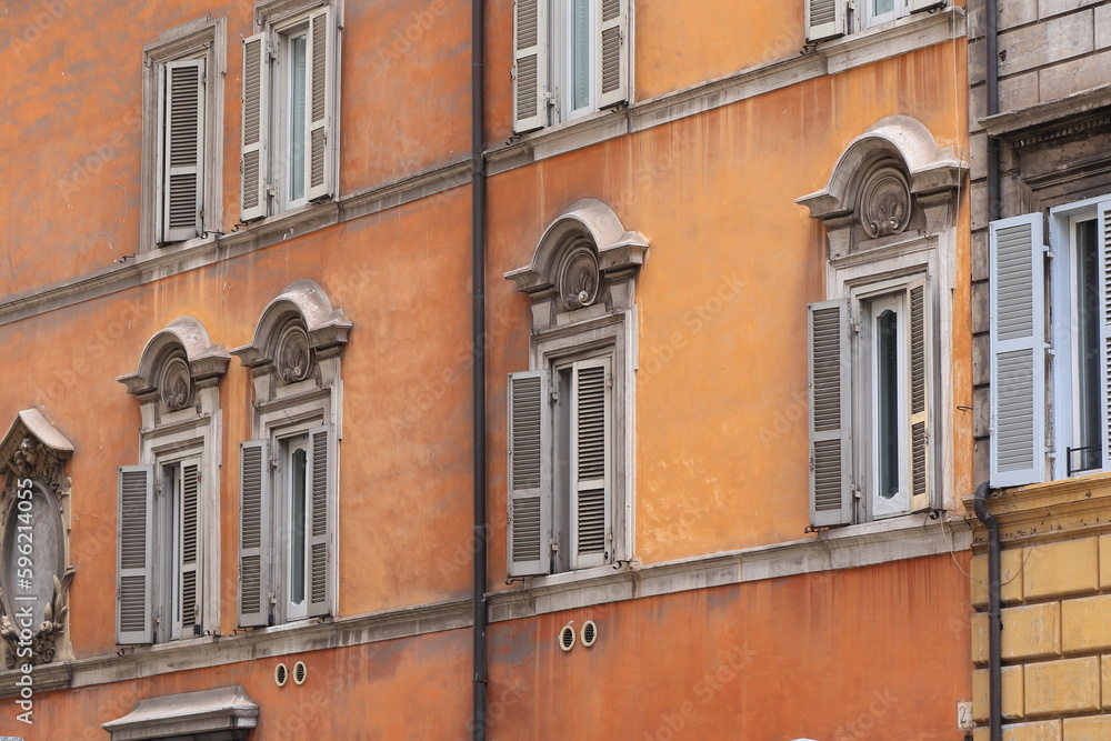 Typical Building Facade Close Up with Windows in Rome, Italy