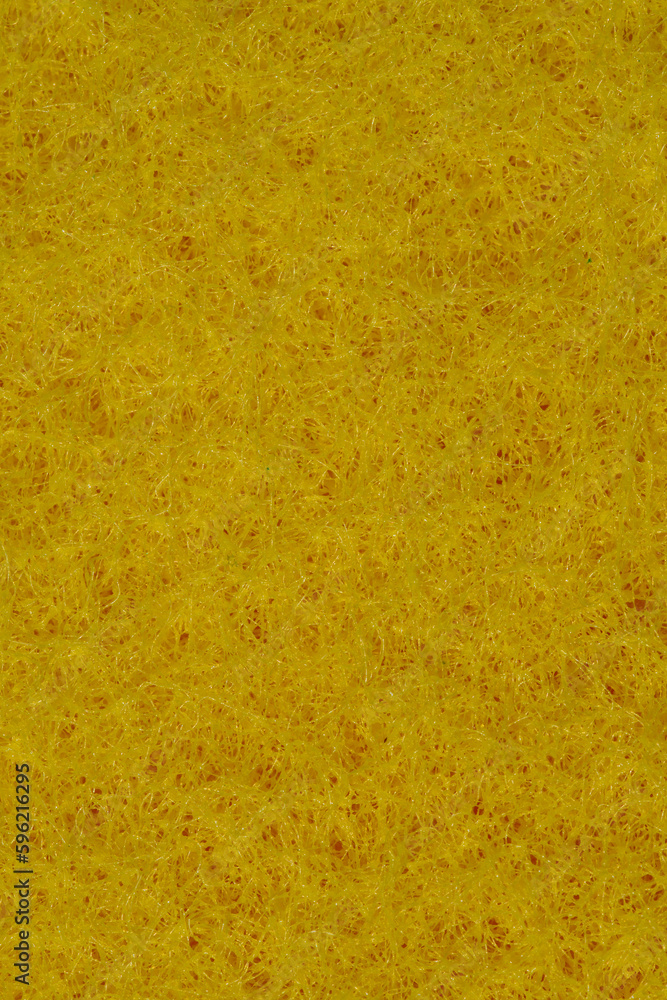Złoto żółta tapeta wyglądającą jak siano stworzona z gąbki do naczyń w zbliżeniu makro - obrazy, fototapety, plakaty 