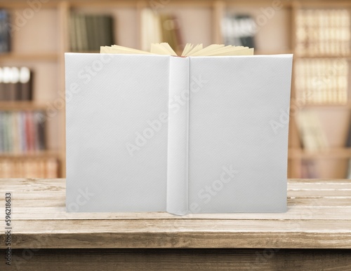 Fotografie Blank white book mockup on wood desk