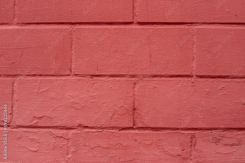 The surface of a brick yellow-and-red wall close-up. The surface of a brick yellow-and-red wall close-up.