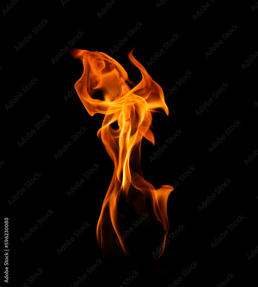 Burning flame isolated on dark background Burning flame isolated on dark background