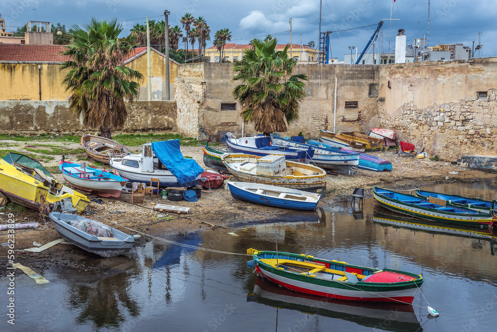Fishing boats in port of Syracuse town, Sicily Island, Italy