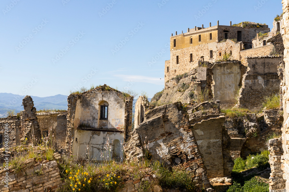 Craco, Basilicata. Abandoned city. A ghost town built on a hill and abandoned due to geological problems. Surreal look, horror film scenery. Panorama of the Calanchi Park.