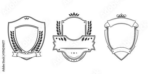 Vintage shield set with ribbon and laurel wreath. Crest badge. Heraldic banner or emblem design template. Coat of arms icon. Vector illustration.