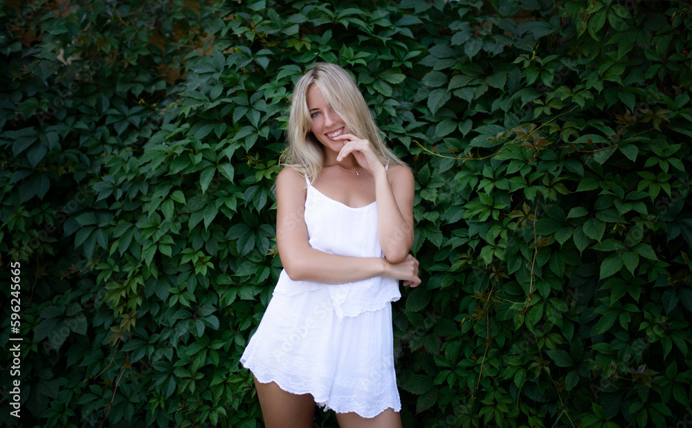 Summer portrait of beautiful young woman with green eyes. Summer portrait of beautiful young woman with green eyes.