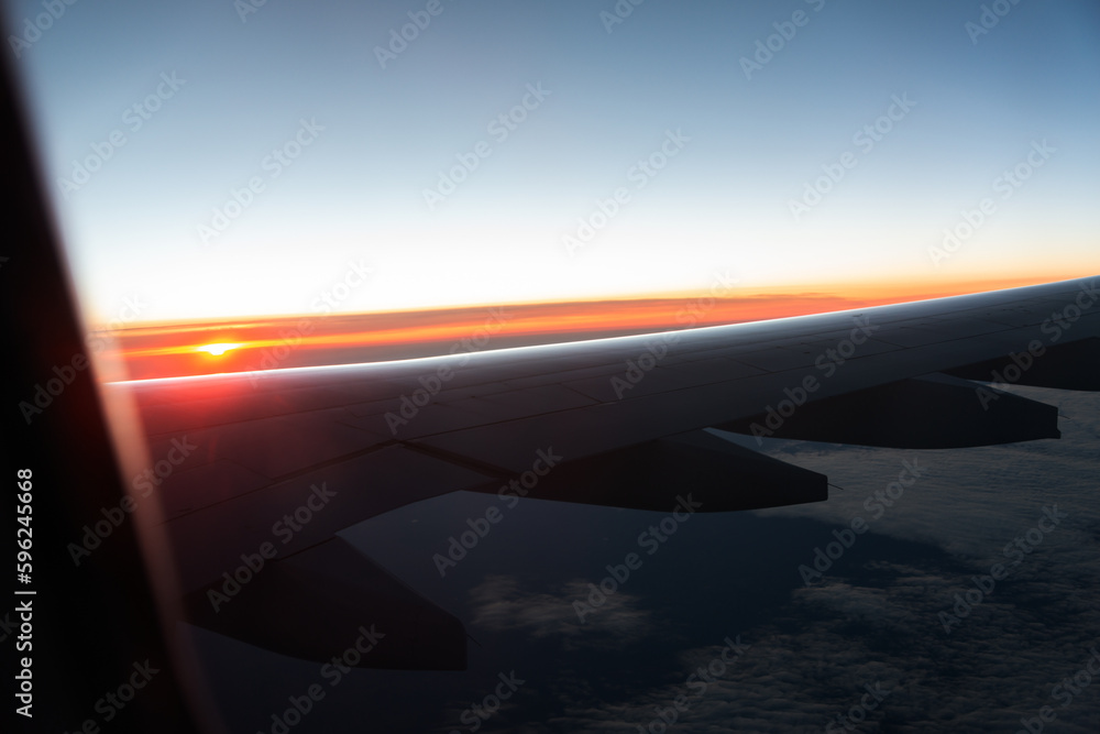 Wing of a airplane at sunrise at an altitude of 11 km. Wing of a airplane at sunrise at an altitude of 11 km.
