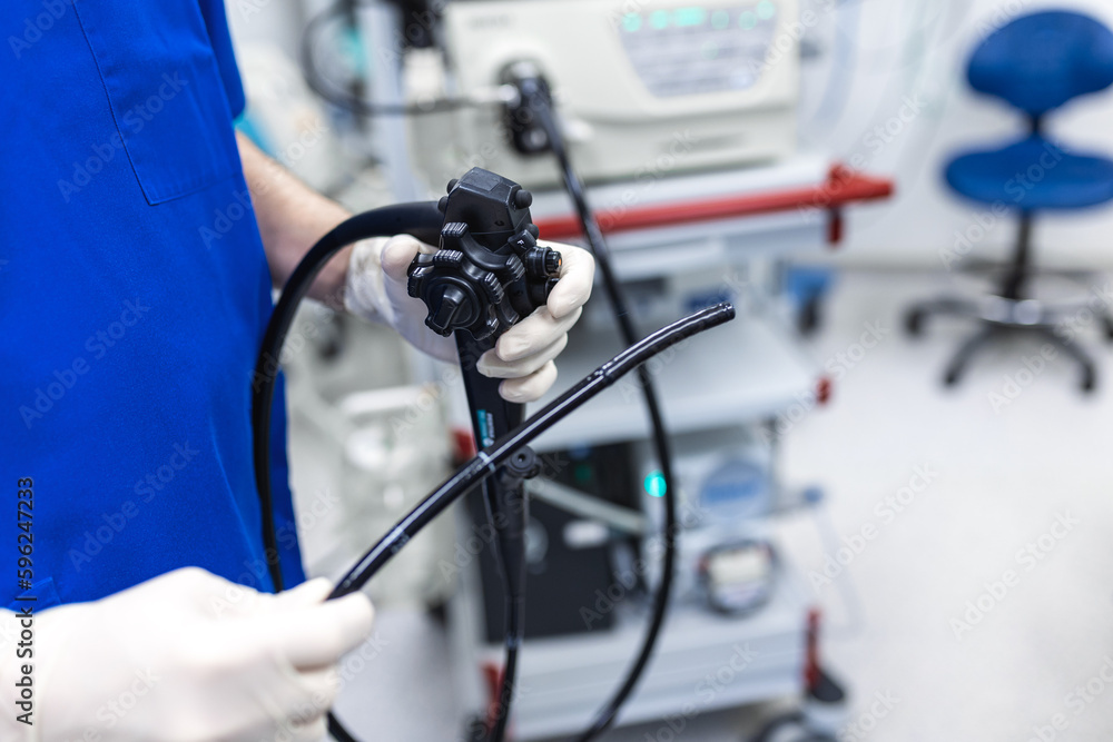 Endoscopy at the hospital. Doctor holding endoscope before gastroscopy. Medical examination