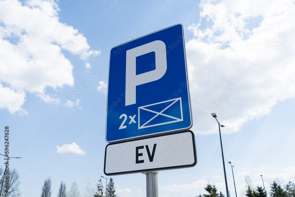 D-18a car parking reserved space sign and EV plate, marking of electric vehicle charging station point. EV cars charger station, road signs in Poland. - obrazy, fototapety, plakaty 