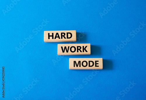 Hard Work Mode symbol. Concept word Hard Work Mode on wooden blocks. Beautiful blue background. Business and Hard Work Mode concept. Copy space
