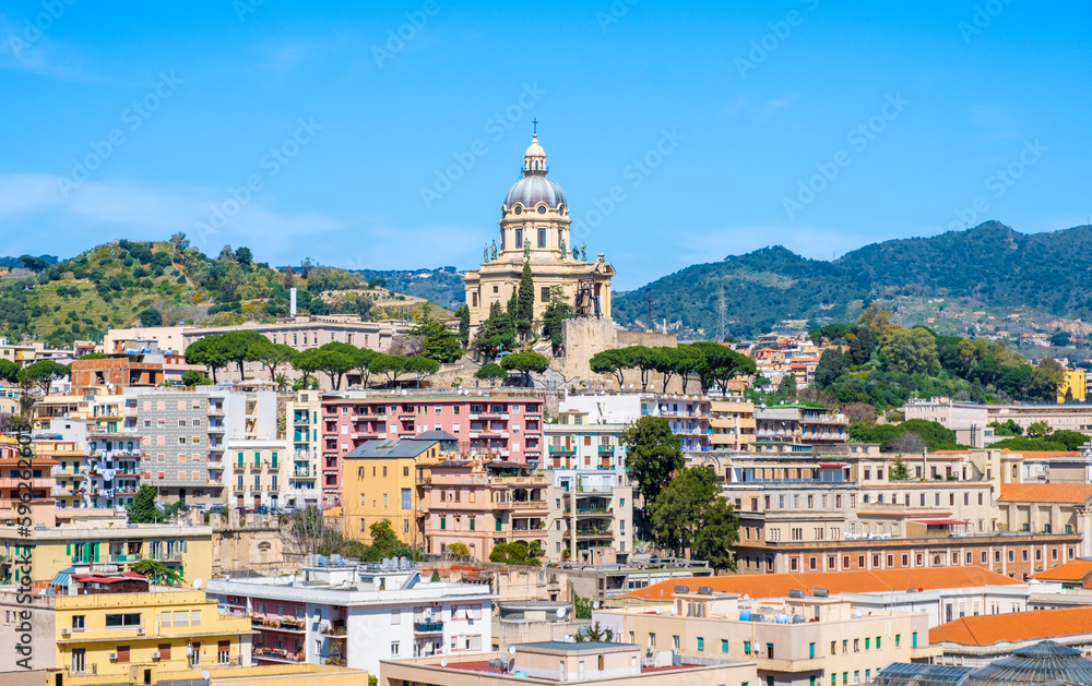 Panoramic view of Messina. Votive Temple of Christ the King or Tempio di Cristo Re on hill over town as memorial to Italian soldiers. Sicily island, Italy