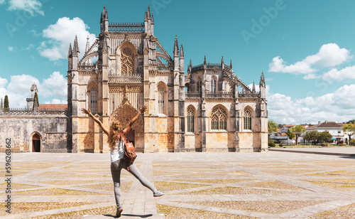 Woman tourist in front of monastery Batalha- Portugal photo