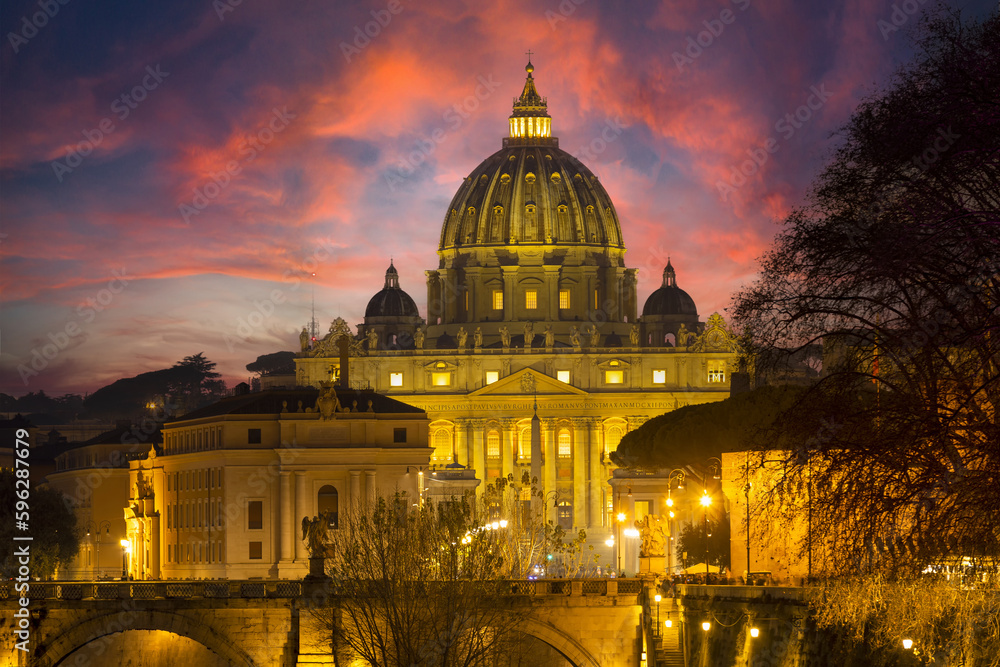 Fototapeta premium Romantic photo of St. Peter's basilica in the Vatican at sunset with red and fiery clouds. Church symbol of the religion of Christianity, home of Pope Francis. Rome Italy Europe Unesco heritage