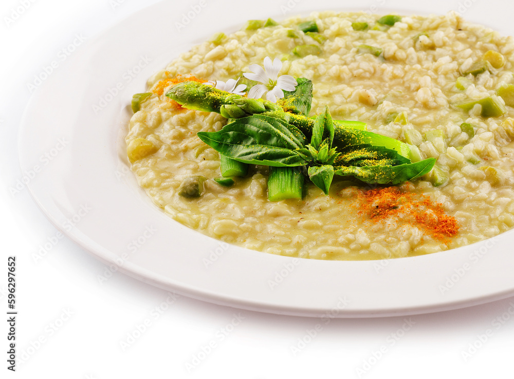 Dish of risotto with asparagus isolated on white plane Dish of risotto with asparagus isolated on white plane